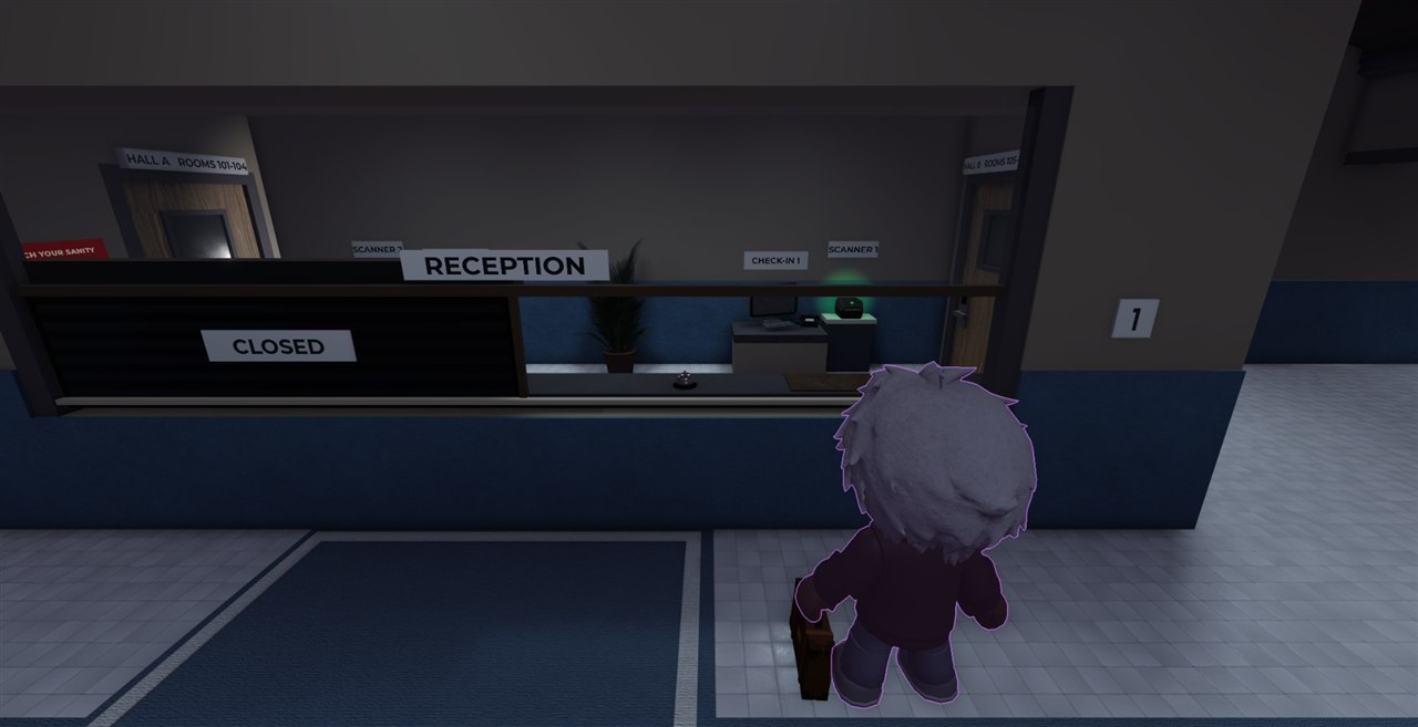 The reception counter, with check-in scanners and a service bell.